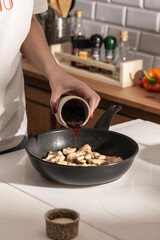 Cooking dinner with teriyaki chicken on the kitchen