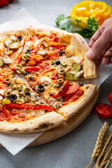 Close up of italian pizza with pepper olive and cheese