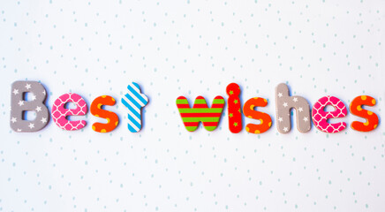 Simple card with text best wishes of different colorful letters.
