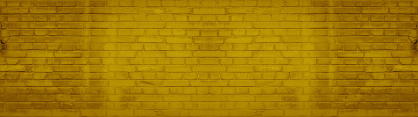 Abstract yellow colored colorful painted damaged rustic brick wall brickwork stonework masonry texture background banner panorama pattern template architecture..