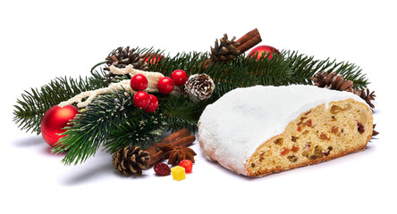 Traditional Christmas stollen cake with marzipan and dried fruit isolated on white background