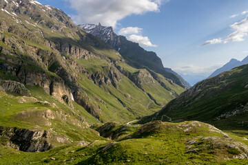 Fototapeta na wymiar Valley of the Aosta mountain range in late spring with side shadow