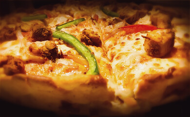 Highly baked creamy Pizza abstract background blur with selective focus. Modern pizza wallpaper backdrop