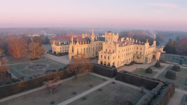 Aerial View Of Lednice Castle, Moravia, Czechia. Famous Tourist Spot. Fairytale Castle In A Baroque Garden, Lit By The Morning Sun. Unesco Cultural Heritage. Winter Season, Moravia, Czech Republic.