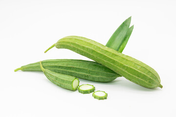 Angled loofah or Ridge gourd slice over on white background