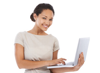 Im never far from my laptop. Studio portrait of a young businesswoman using a laptop isolated on white.