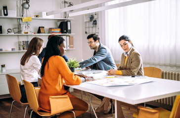 Cinematic image of   employers working in a start up business. Young people at work in a modern office