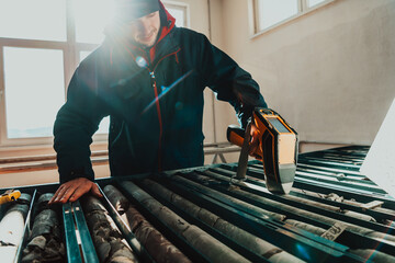A special team of geologists who study rocks in industry using modern machines.Selective focus 