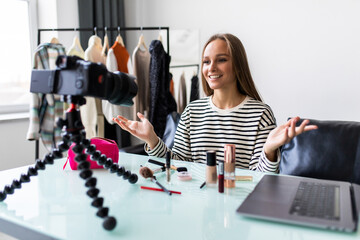 Young woman beauty fashion blogger recording video, Vlogger recording broadcast at home.