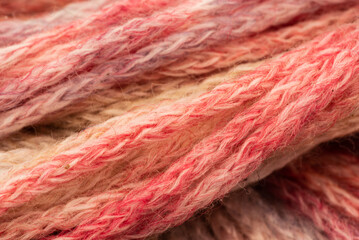 The Netherlands, February 2022. Close up of colored wool on a white background.