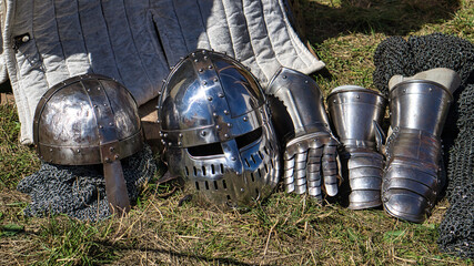 Medieval equipment, helmet, metal glove, armor. Medieval spectacle in times gone by.