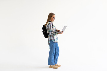 Smiling female student holding laptop and looking at camerisolateda on a white background
