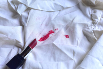 Stains of lipstick or makeup on white clothes or stains on clothes from everyday accidents. Concept...
