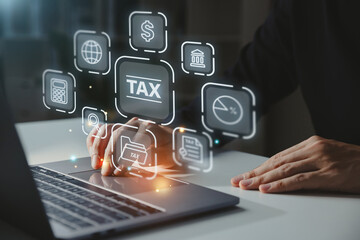 Tax icons concept, Young businessman working with laptop.