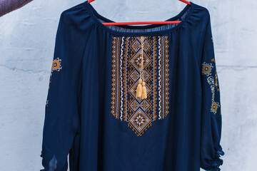 Ukrainian embroidered elements, concept of ethnic clothes, fashion details