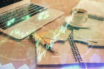 Multi exposure of forex graph drawing and desktop with coffee and items on table background. Concept of financial market trading