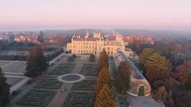 Aerial View Of Lednice Castle, Moravia, Czechia. Famous Tourist Spot. Fairytale Castle In A Baroque Garden, Lit By The Morning Sun. Unesco Cultural Heritage. Winter Season, Moravia, Czech Republic.