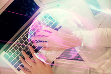 Double exposure of woman hands working on computer and tech theme hologram drawing. Top View. Technology concept.