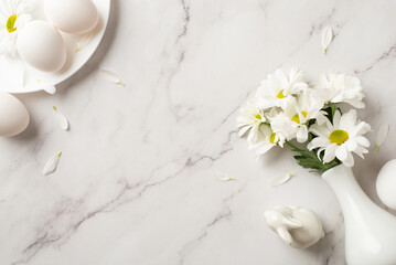 Fototapeta na wymiar Top view photo of the white vase with bouquet of chrysanthemum figure of rabbit and plate with few eggs and daisy on isolated marble background blank space