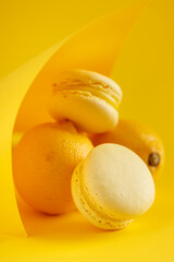 Lemon macaroons on a yellow background