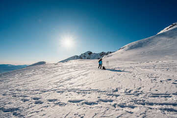 Ziarska dolina, slovakia, 10.2.2022. Mountaineer backcountry ski walking ski alpinist in the mountains. Ski touring in alpine landscape with snowy trees. Adventure winter sport. © Zedspider