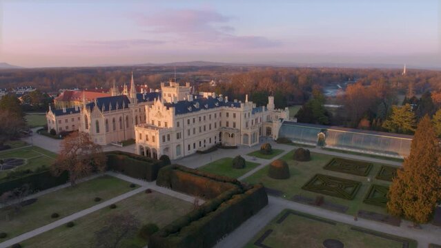 Aerial View Of Lednice Castle, Moravia, Czechia. Famous Tourist Spot. Fairytale Castle In A Baroque Garden, Lit By The Morning Sun. Unesco Cultural Heritage. Winter Season, Moravia, Czech Republic.
