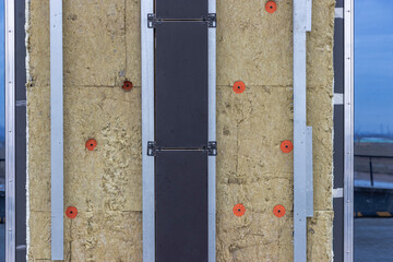 Power saving technology: plates of mineral wool on the side wall, between the metal profiles for...