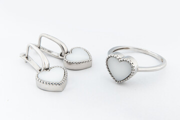 Silver jewels collection with crystals in minimalism style. Silver set of earrings and silver necklace