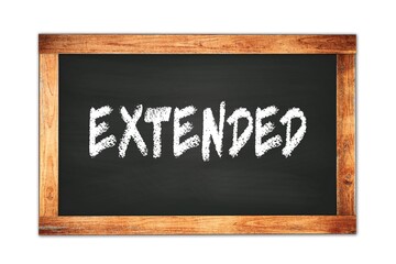 Fototapeta premium EXTENDED text written on wooden frame school blackboard.