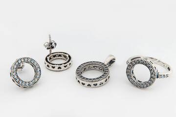 Silver jewels collection with crystals in minimalism style. Silver set of earrings and silver necklace