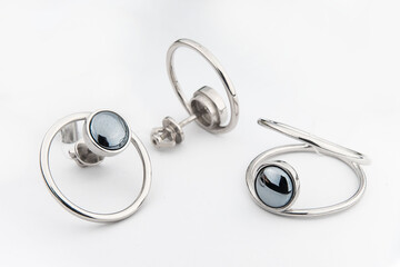 Silver jewels collection with crystals in minimalism style. Silver set of earrings and silver necklace