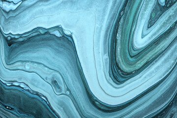 Abstract fluid art background light blue and cerulean colors. Liquid marble. Acrylic painting with turquoise gradient.