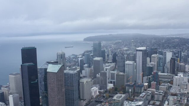 Orbiting aerial shot of Seattle's dreary downtown buildings.