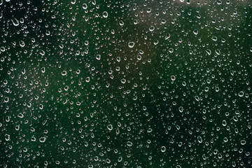 Fototapeta na wymiar rain drops on the window surface