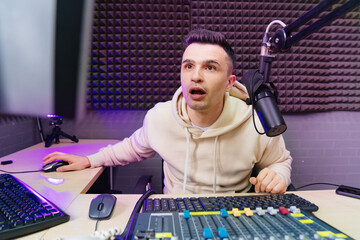 surprised professional radio host broadcasts live reads news on computer screen.