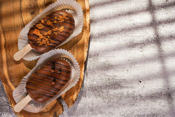 Homemade cookies with raisins, chocolate, nuts on a wooden table and a art background . Breakfast. Close up.