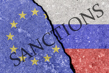 The crack between the Russian Federation and European Union flags. The concept of sanctions. - obrazy, fototapety, plakaty