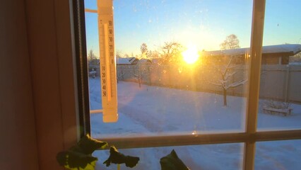 a sunny winter morning thermometer shows 20 degrees of cold frost