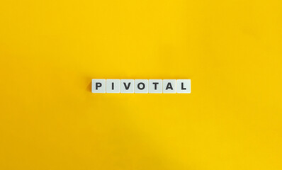 Pivotal Word on Letter Tiles on Yellow Background. Minimal Aesthetics.