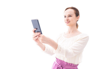Fototapeta premium セルフィーを撮影する若い女性