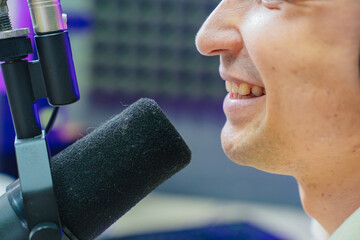 close up mouth and microphone. professional radio host on live streaming