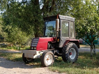 Old red mini tractor.