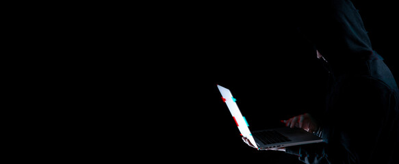 Cyber security hacker concept. Internet web hack technology. Blurred Digital laptop in hacker man...