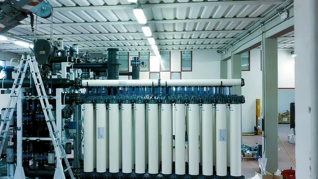 Slow motion view of a reverse osmosis system for water drinking plant. Water purification system, industrial environment from drone