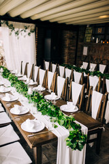 Table setting at a luxury wedding and beautiful flowers on the table.