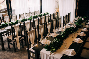 Table setting at a luxury wedding and beautiful flowers on the table.