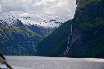 Breathtaking scenery of mountains, galciers and waterfalls in Geirangerfjord during cruising to...