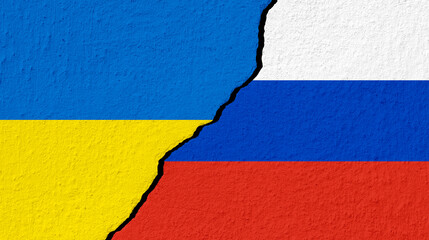 Conceptual image of war between Russia and Ukraine with cracked wall with national flag