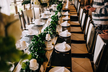 Table setting at a luxury wedding and beautiful flowers on the table.