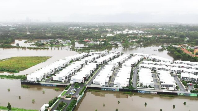 Aerial view of water very close to houses during the 2022 QLD Floods in Robina Gold Coast QLD Australia